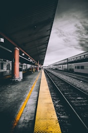 selective color photography of train railways