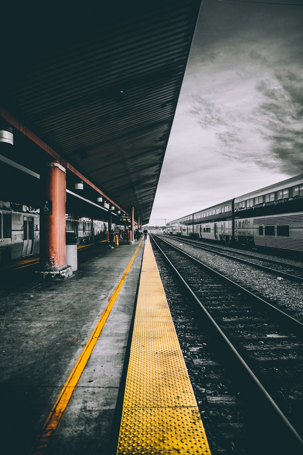 selective color photography of train railways