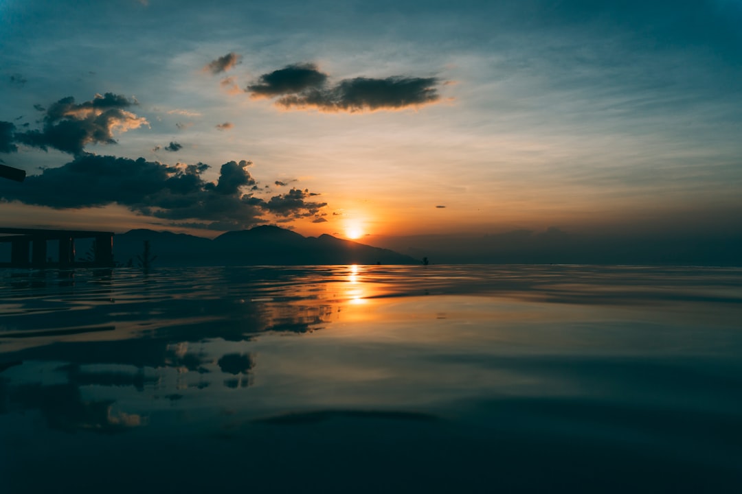 body of water during sunset