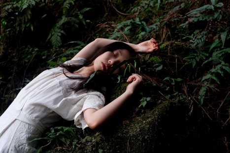 woman in white dress lying in white dress