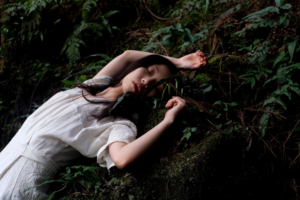 woman in white dress lying in white dress