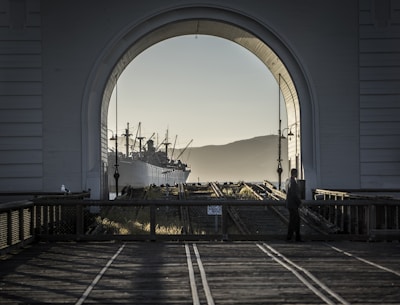 An early morning shot of a ship leaving port, reflecting commitment to uptime and schedule.