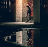 man learning on concrete wall