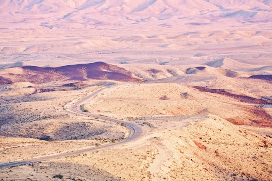 aerial photography of road between desert at daytime in Yeruham Israel