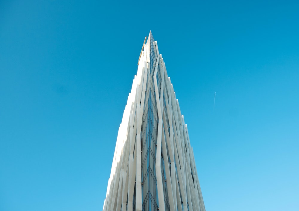 photography of white building under clear blue sky