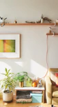 A cozy living room showcasing unique 3D printed home decor pieces on shelves