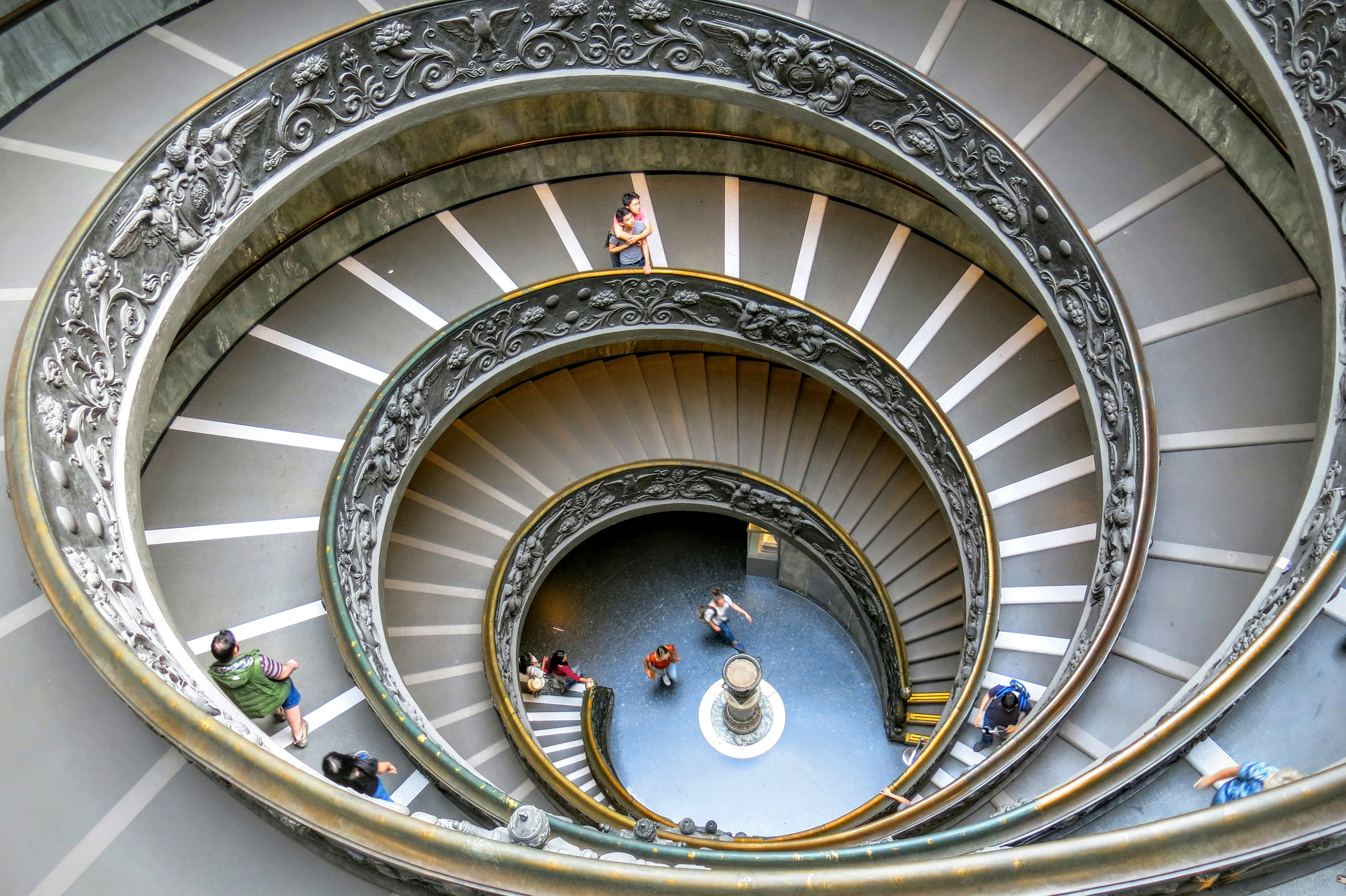 great photo recipe,how to photograph this was one of the last photos i took at the vatican museum in june 2016. the museum was crowded, amazing and overwhelming. as i was leaving i realized that this was the photo on the cover of one of my human development texts. i looked down and saw two men embracing. they seemed to be in a moment of awe. i loved the juxtaposition.; brown and gray spiral ladder