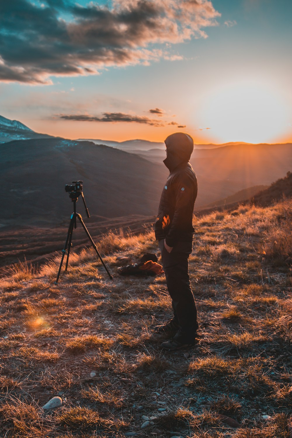 man near tripod with camera