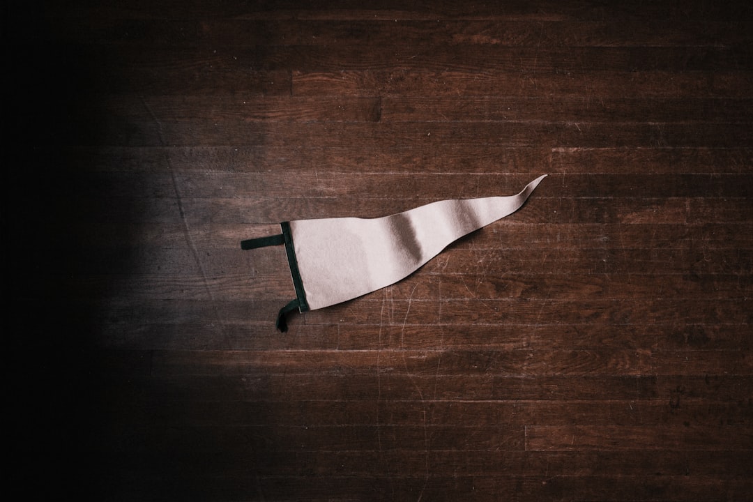 white pennant on brown surface, Instagram - @andrewtneel | Donations - paypal.me/AndrewNeel