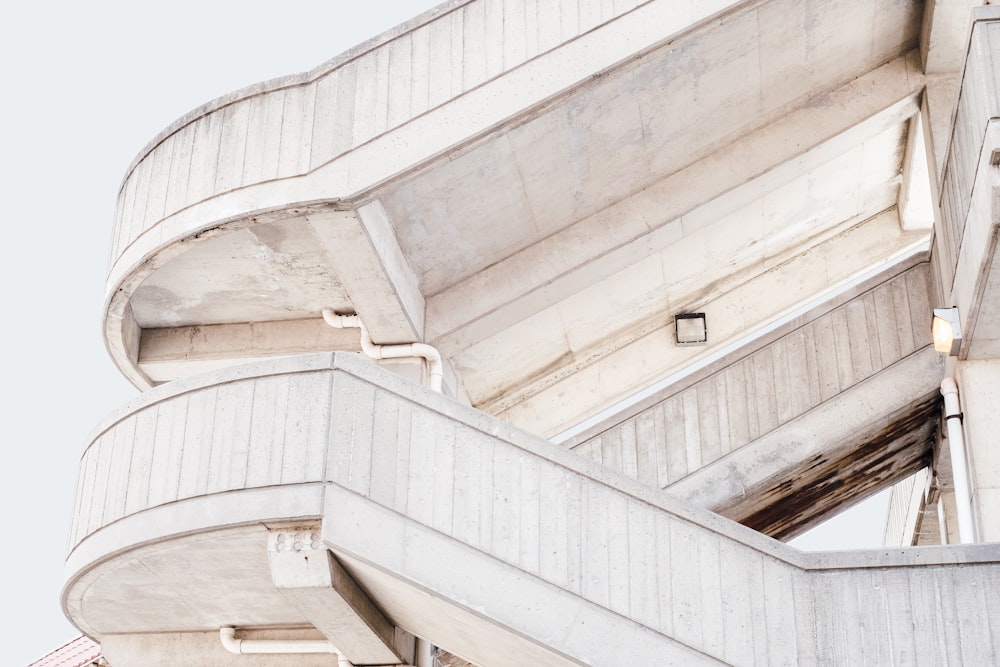 beige concrete stairs with white skies background