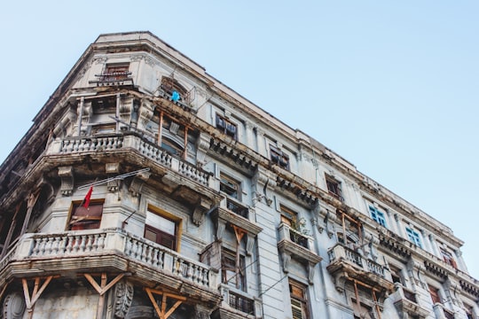 concrete building with balconies during day in Havana Cuba