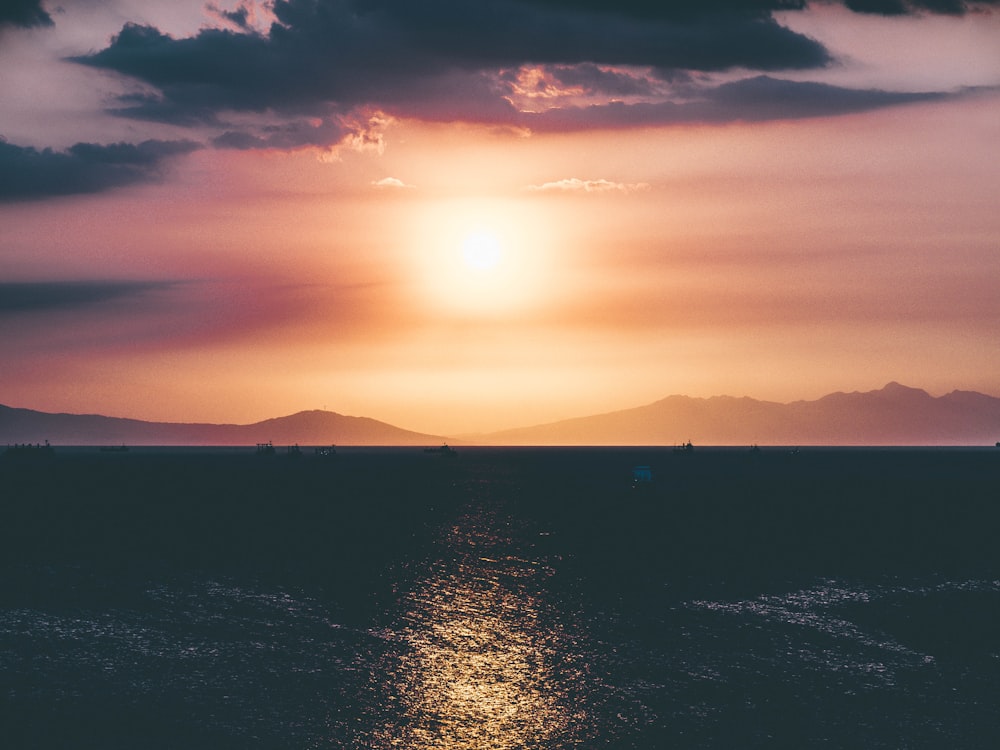 ocean and island during sunset