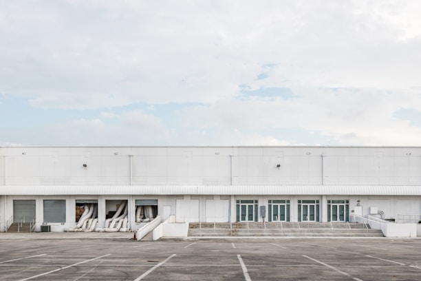 Modern commercial warehouse exterior with clear sky