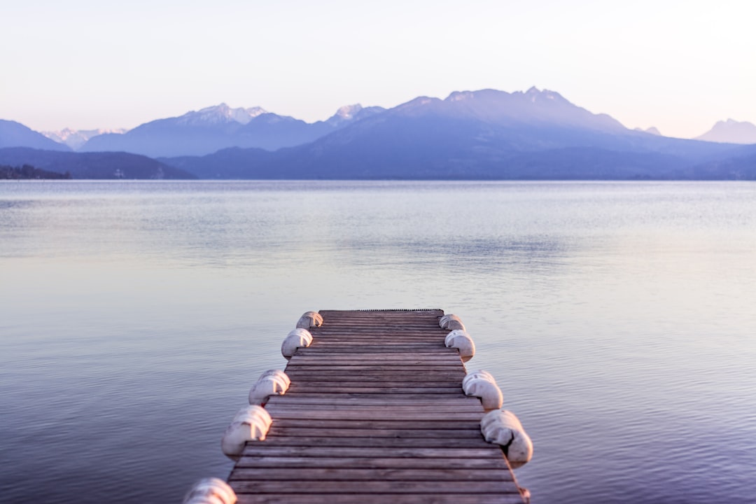 brown wooden boat dock in gray skies background