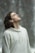 man in gray pullover hoodie closed eyes while heads up