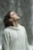 man in gray pullover hoodie closed eyes while heads up