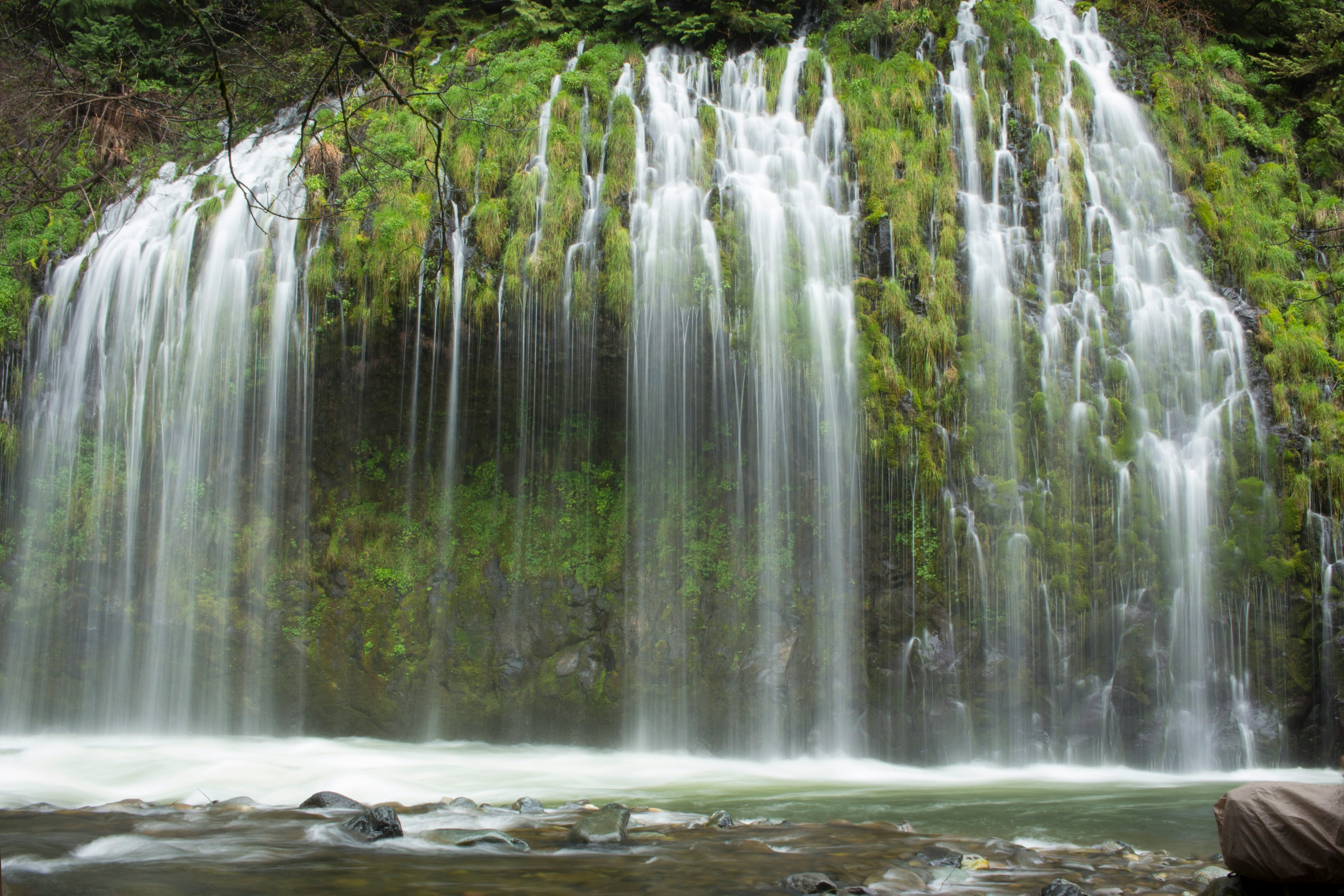 water falls with rocks and trees