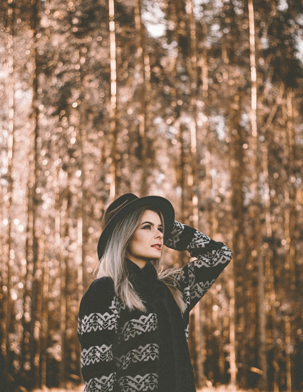 woman standing on forest