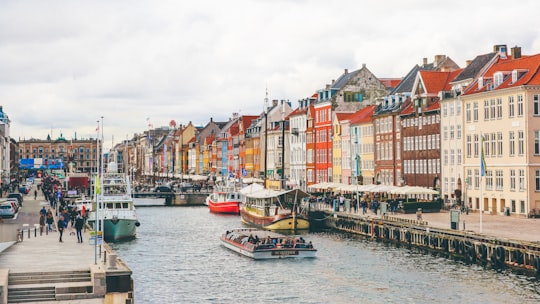 group of people riding boat during daytime in Nyhavn Denmark