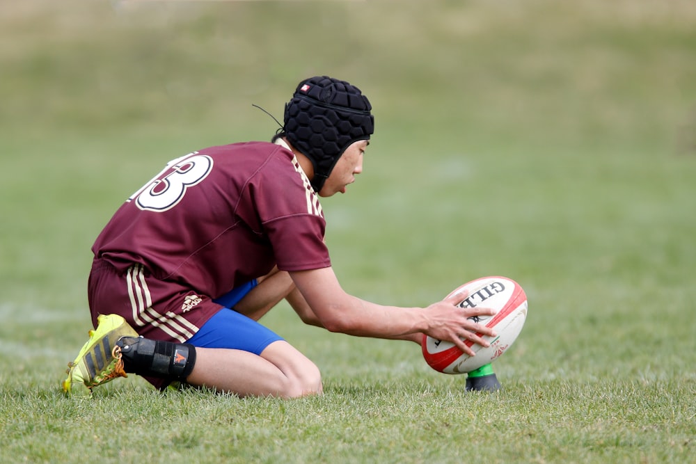 football player holding football