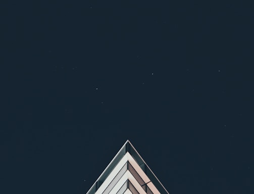 white building under stars