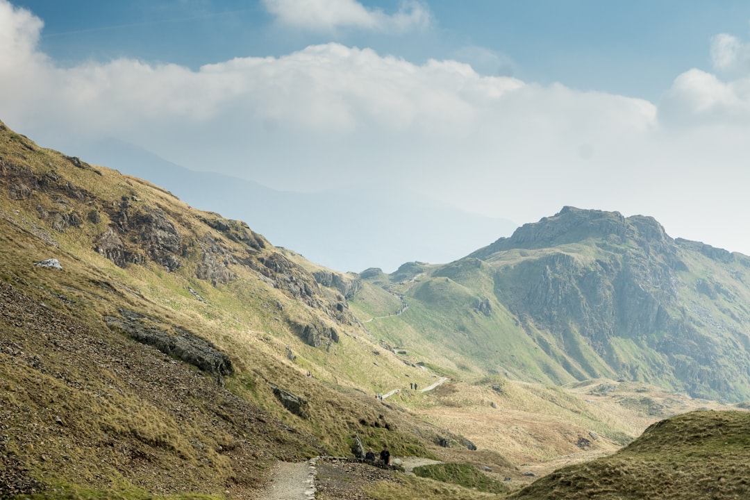 green mountains under cloudy sky, Looking backwards