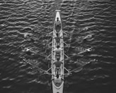 people riding boat on body of water