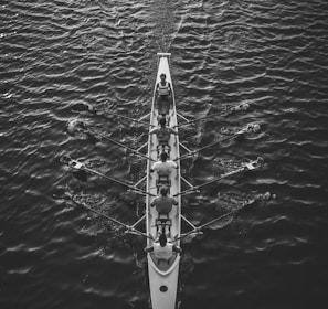 people riding boat on body of water