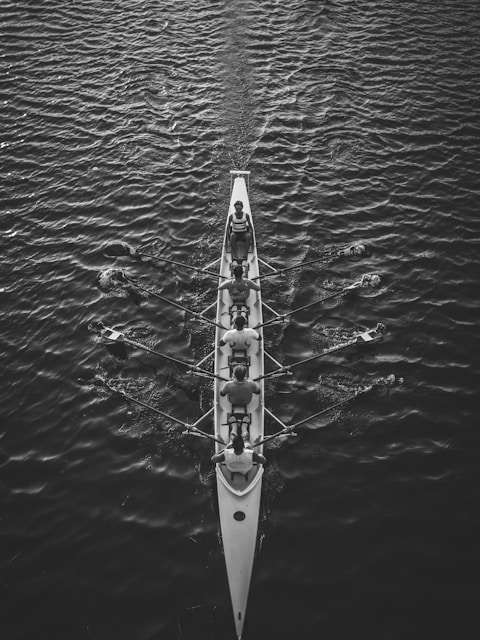 people riding boat on body of water