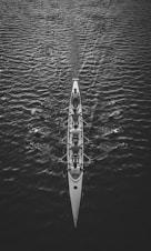 people riding boat on body of water