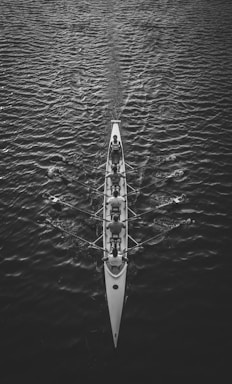 people riding boat on body of water