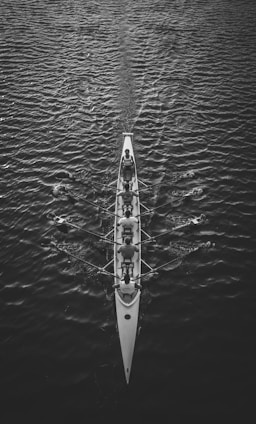 people riding boat on body of water