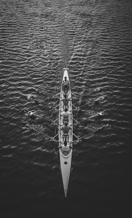 people riding boat on body of water