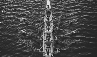 people riding boat on body of water