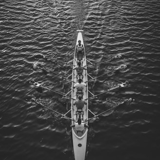 people riding boat on body of water