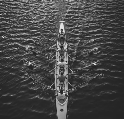 people riding boat on body of water