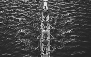 people riding boat on body of water