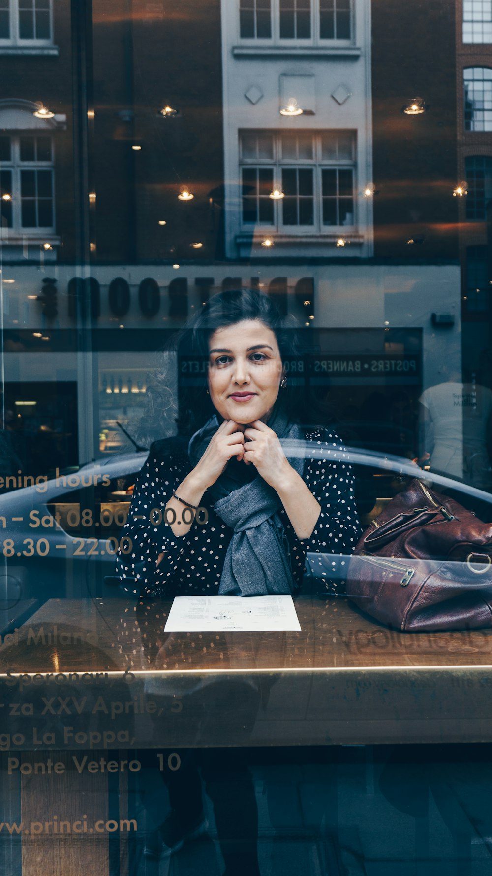 woman sitting in chair beside table