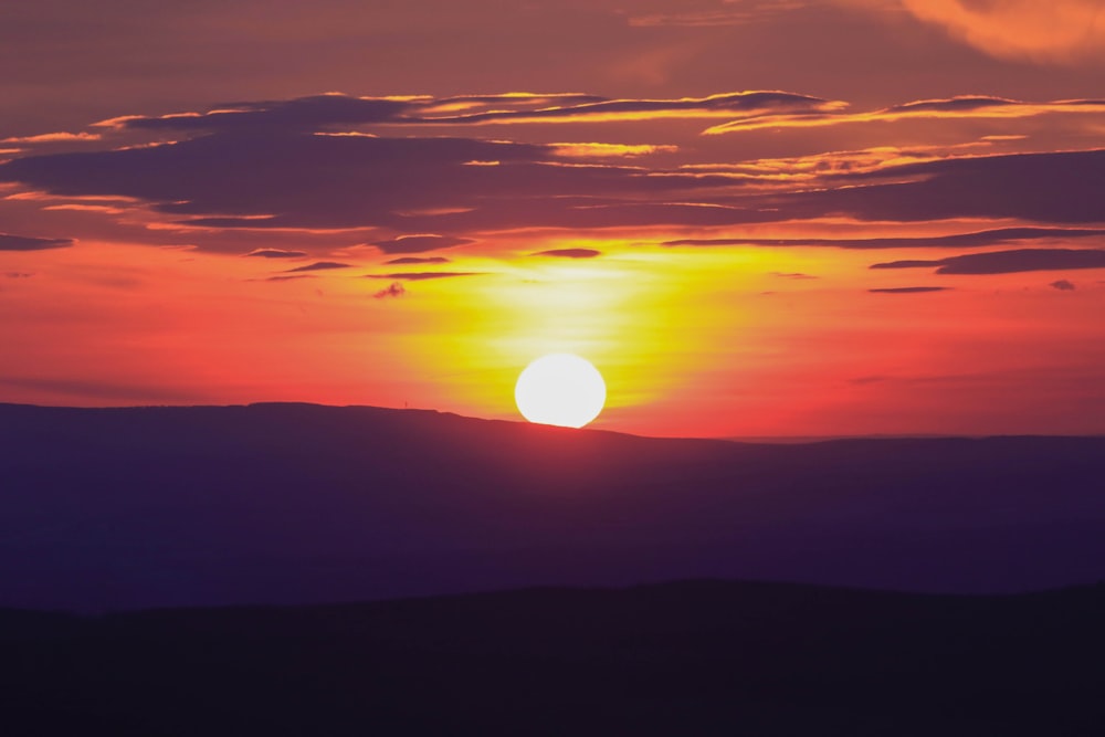 silhouette of mountain under golden hour