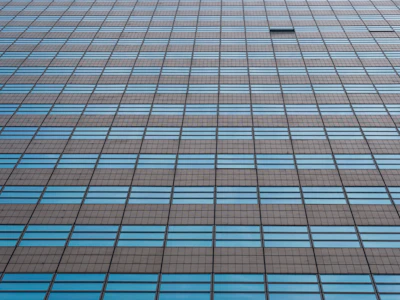 Close-up of a modern Chicago high-rise window reflecting cityscape, no humans.