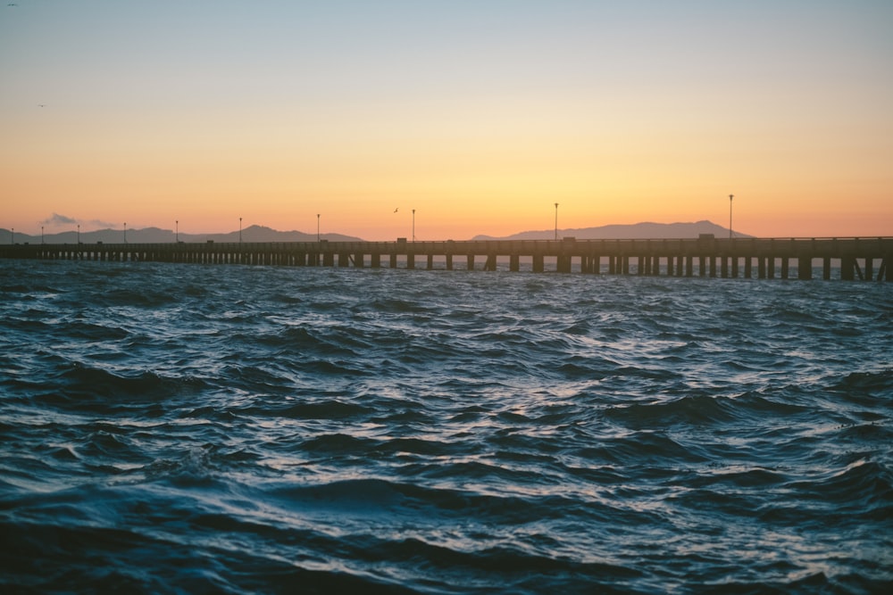 concrete bridge on body of water