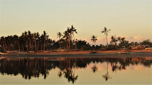 A scenic view of the Konkan coastline with fishermen boats at dawn, reflecting the roots of our brand.