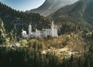 landscape photo of castle near the mountain