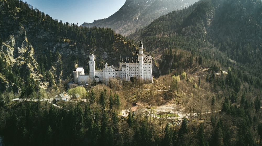 landscape photo of castle near the mountain