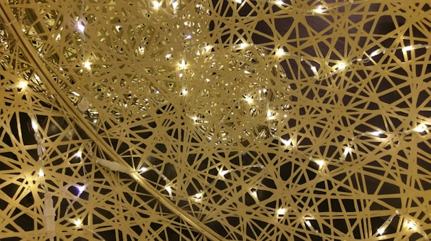 A dreamlike image of golden light weaving through delicate silver threads symbolizing inner transformation.