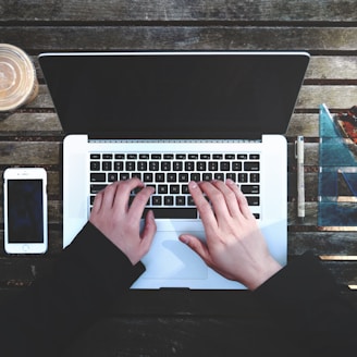 flat-lay photography of person about to use laptop computer