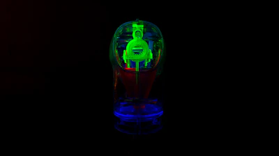 A sleek futuristic accessory glowing with neon blue light, set against a starry cosmic background.