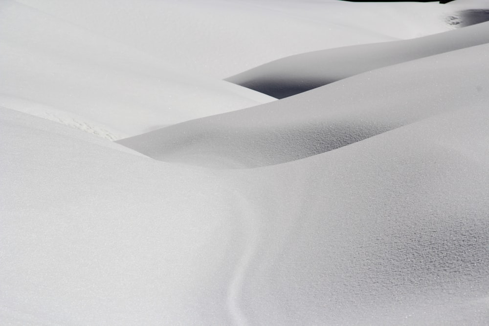 Small mountain slopes covered in white snow.