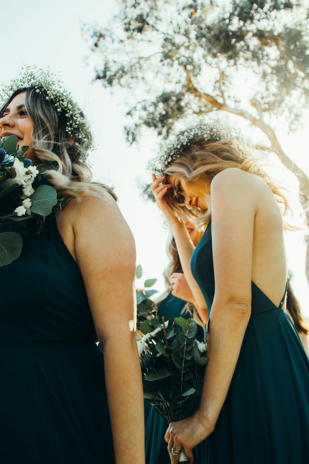 women wearing blue dresses