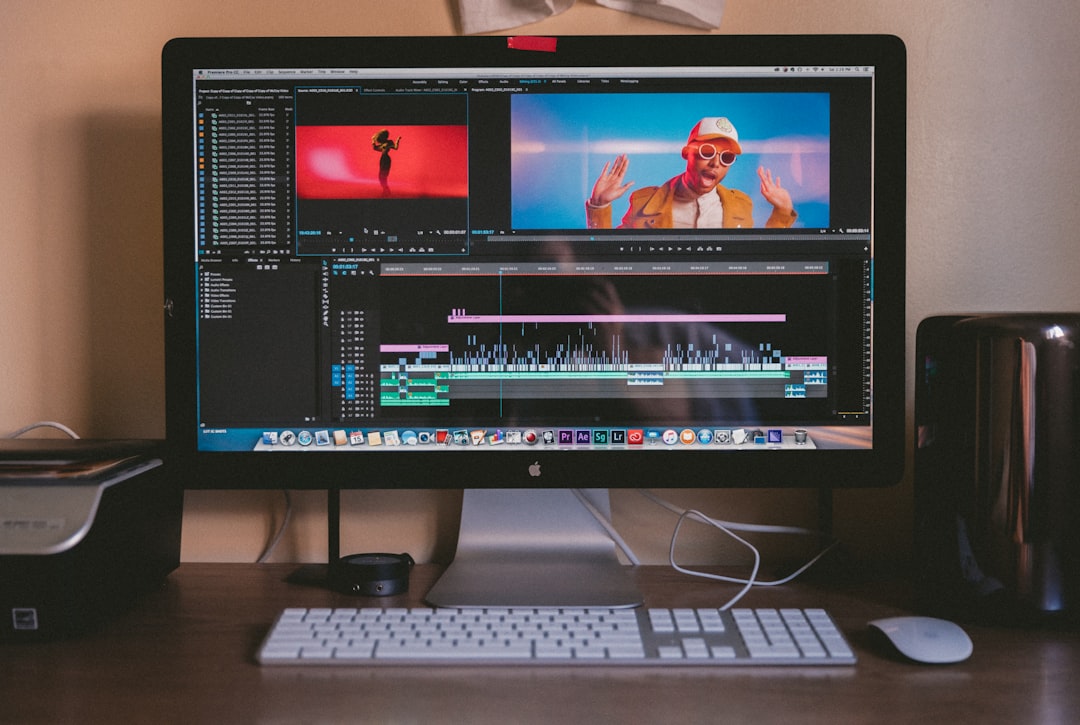 turned on iMac and Apple Magic Keyboard and mouse on table, Limbo Edit